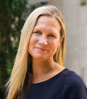 Gretel poses for headshot wearing black sweater