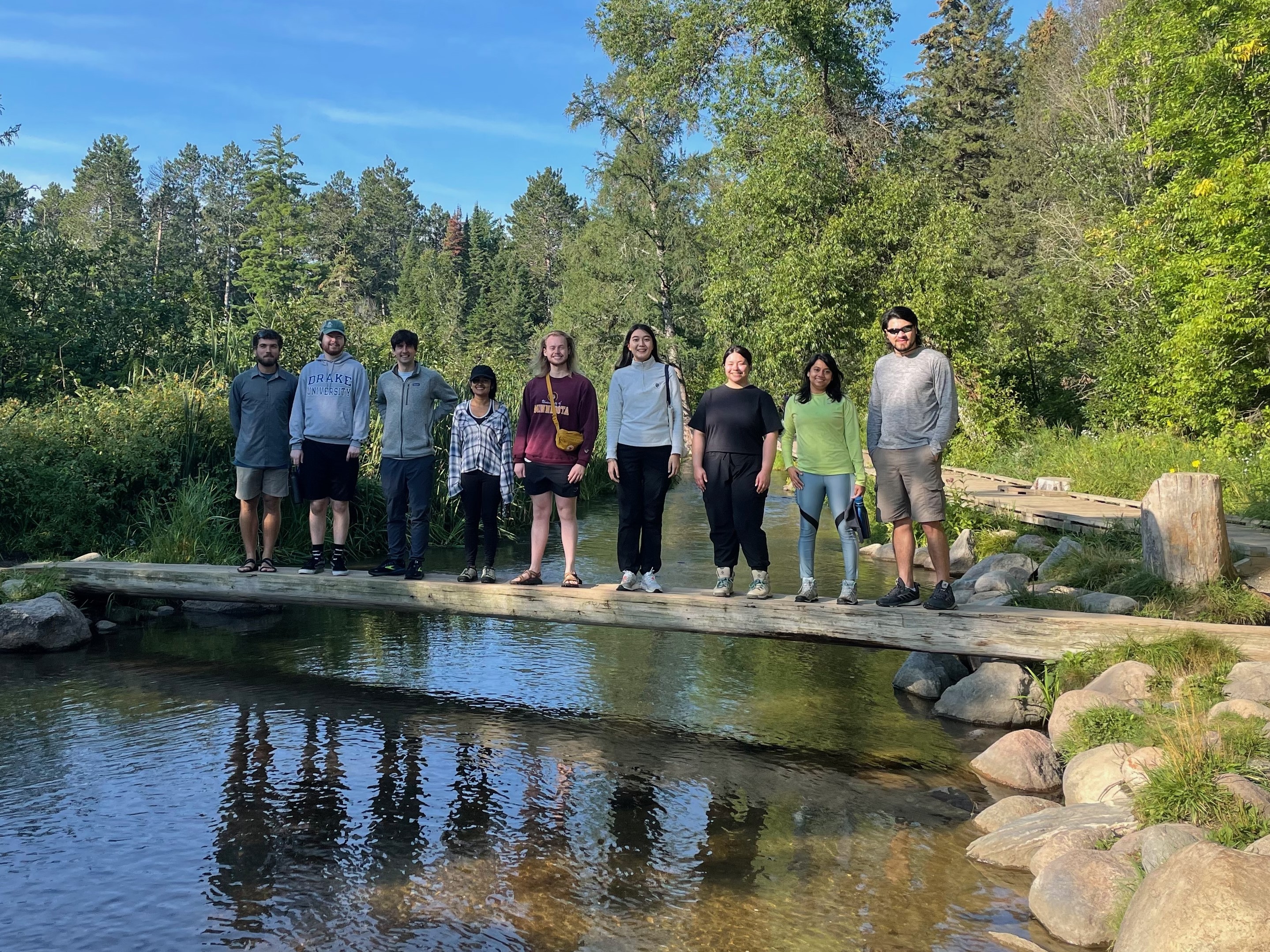 Nine graduate students at the Mississippi headwaters bridge