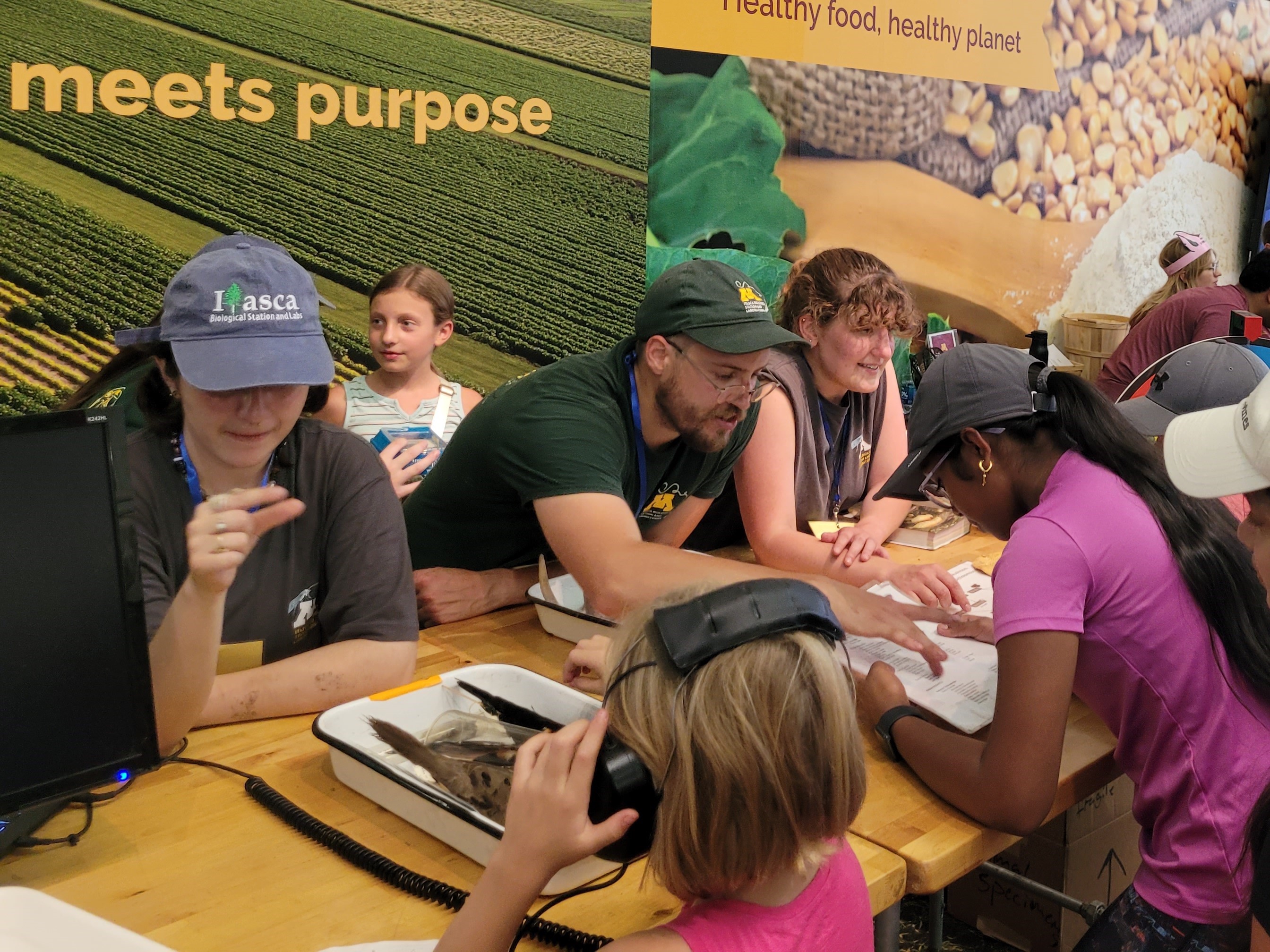 IBSL Booster Club members at the MN State Fair, teaching fairgoers about the different classes offered at Itasca Station