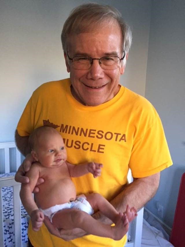 Dave Thomas holding granson Gabe.