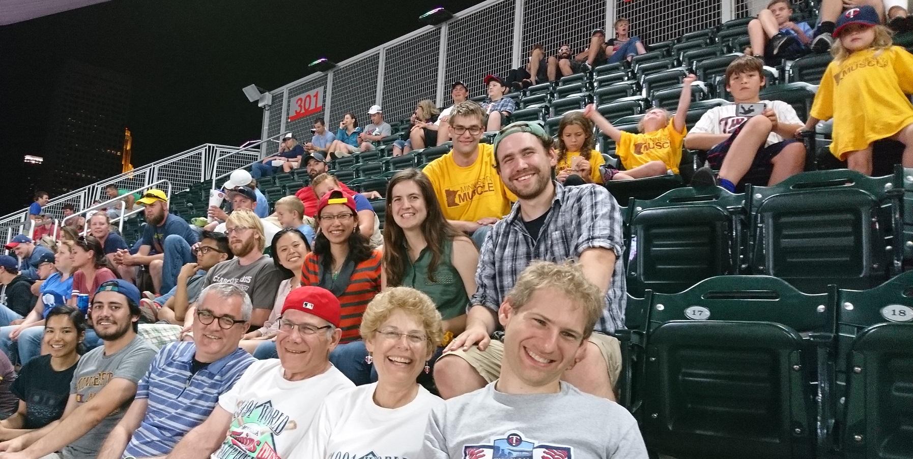 Members of the Thomas lab at a baseball game.