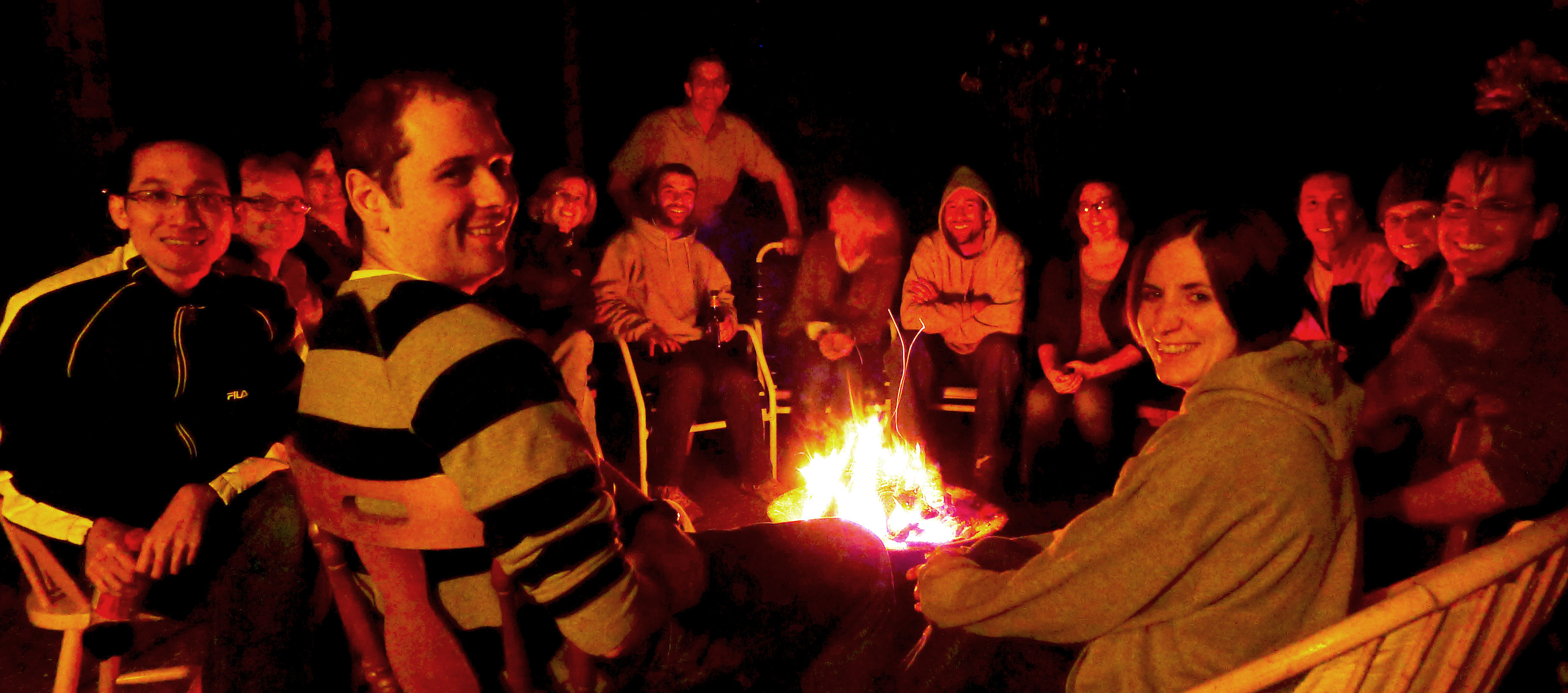 Members of Seelig lab sitting around a fire