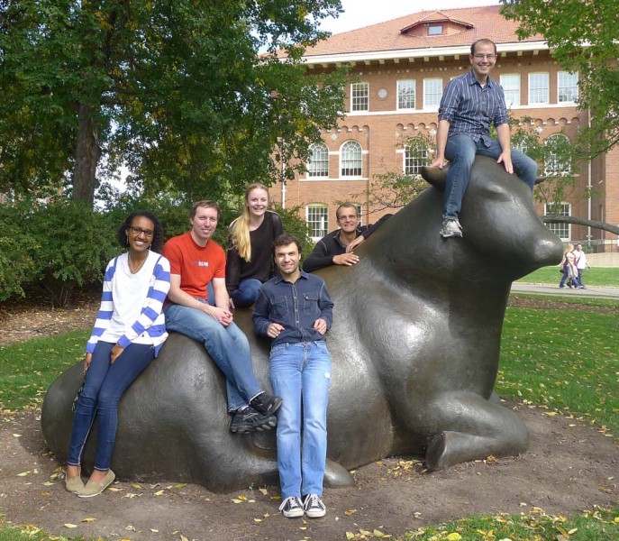 Seelig lab members on the cow sculpture