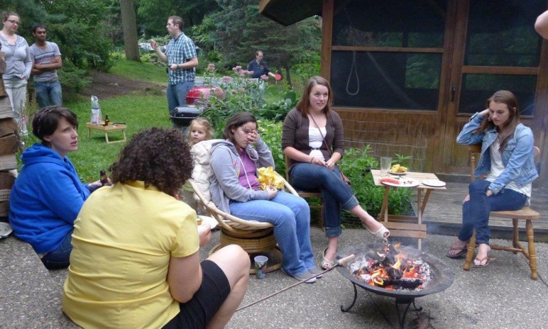 Members of the Seelig lab sitting in a group talking outside