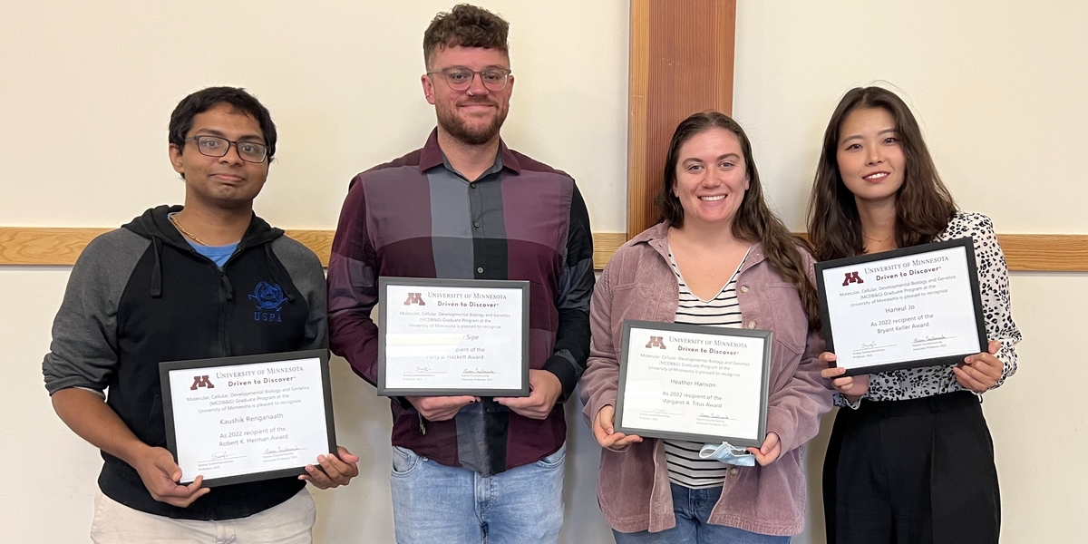 MCDB&G graduate award winners pose with their awards. 