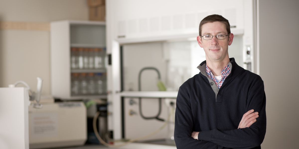 Will Harcombe standing in the lab