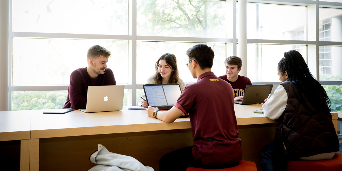 Students working in MCB lobby