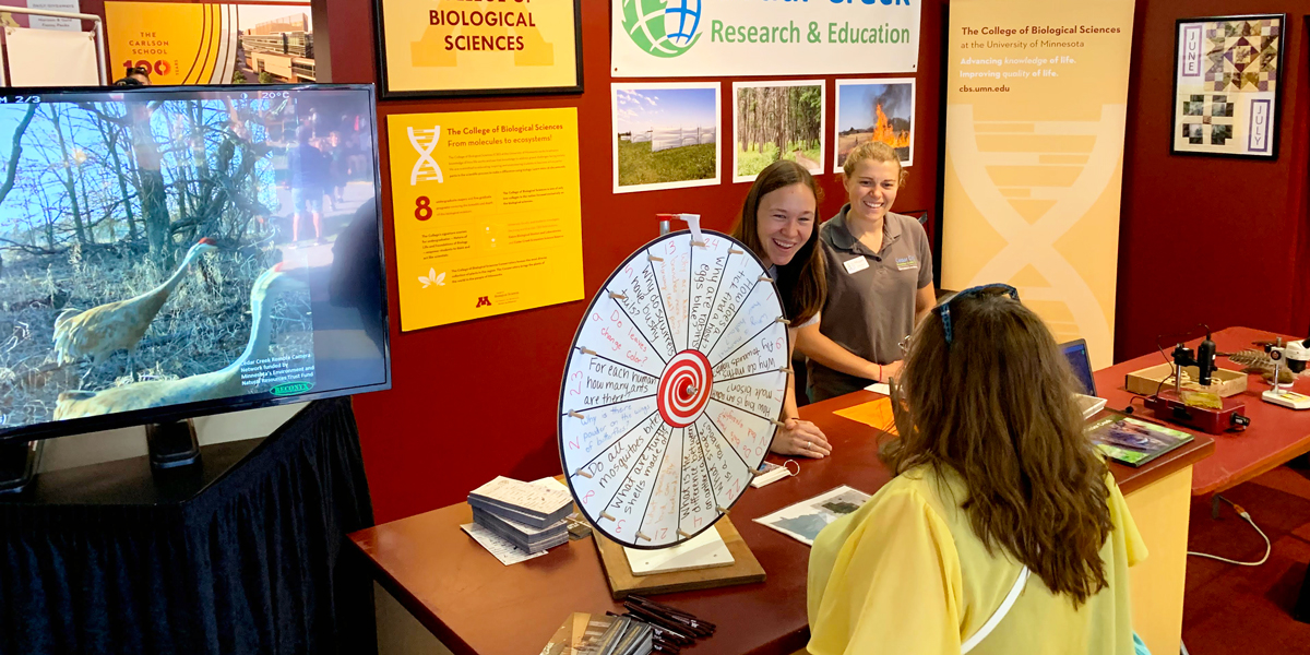 Staff from Cedar Creek talking with Minnesota State Fair attendees