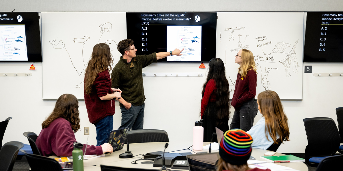 Teaching Associate Professor Charlie Willis interacting with students