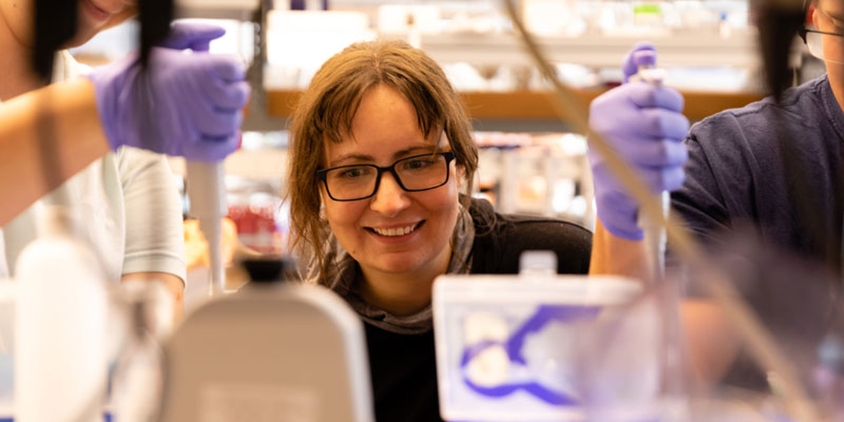 Kate Adamala with students in lab