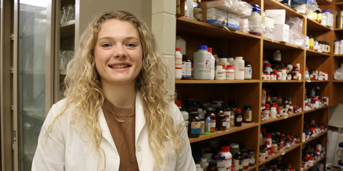 Maddy Bygd stands in the lab