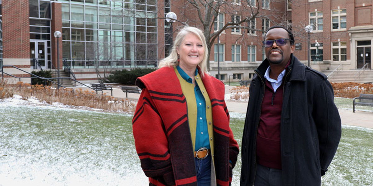 Warfa and Smith-Keiling stand outside for a photo