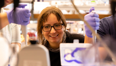 Kate Adamala with students in lab