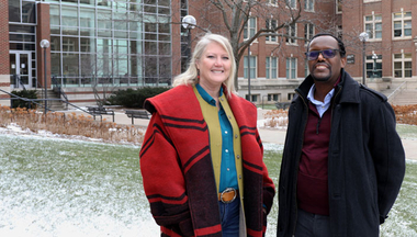 Warfa and Smith-Keiling stand outside for a photo