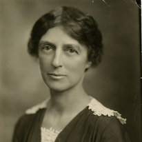 a sepia photo of a white woman with dark hair