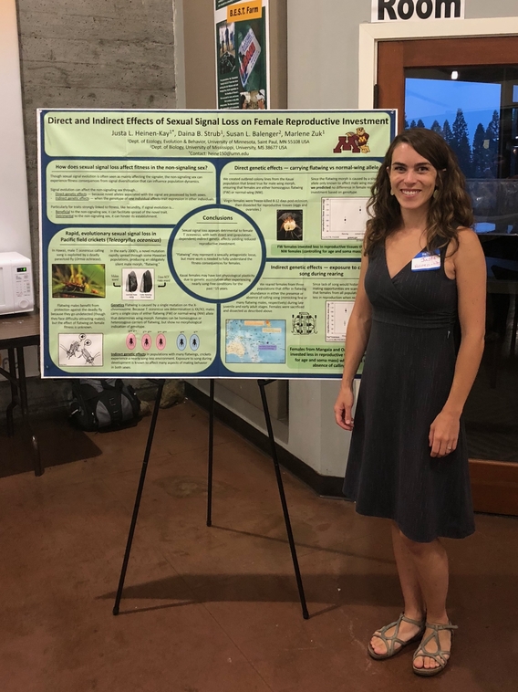 Justa Heinen-Kay in front of a research poster